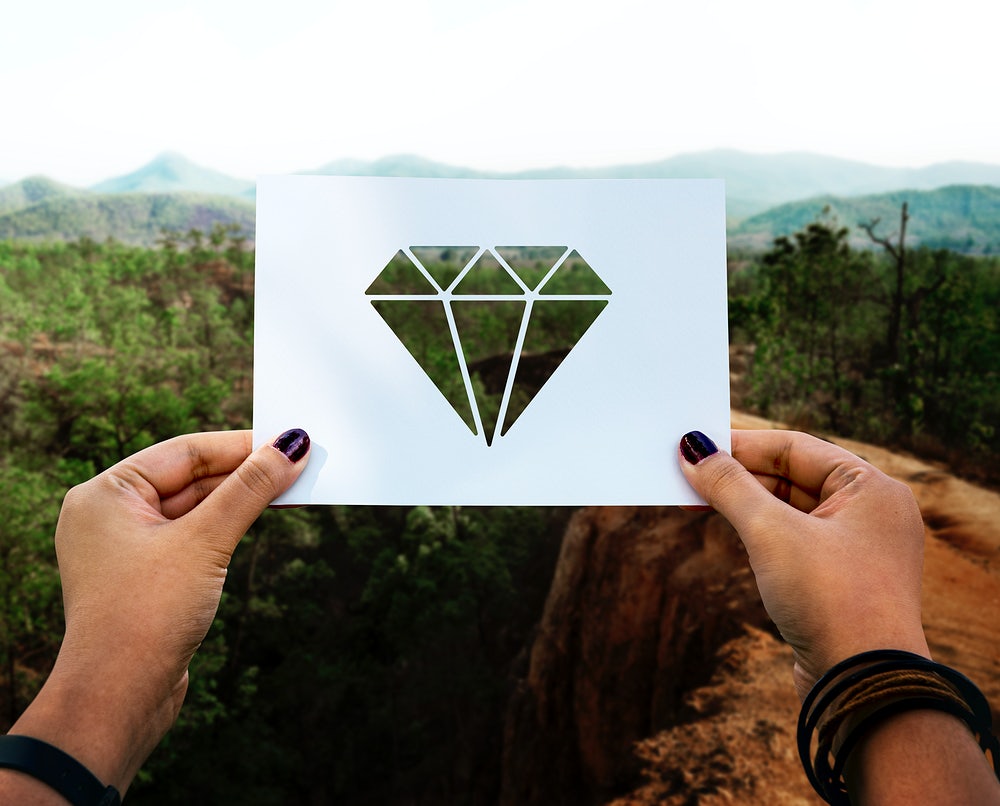 woman holding a diamond stencil